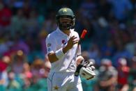 Cricket - Australia v Pakistan - Third Test cricket match - Sydney Cricket Ground, Sydney, Australia - 7/1/17 Pakistan's Misbah-ul-Haq reacts as he walks off the ground after being caught by Australia's Nathan Lyon. REUTERS/David Gray