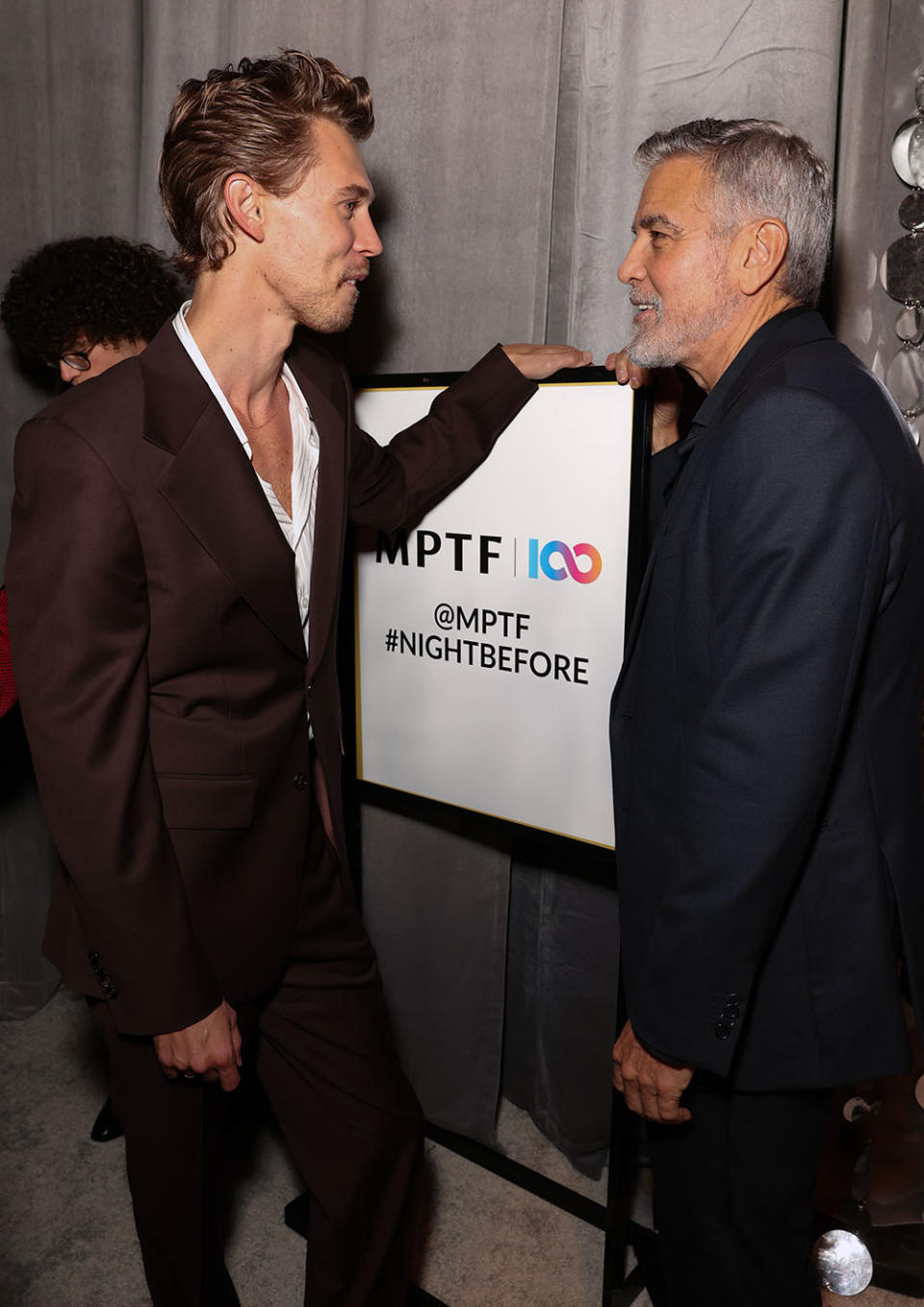 Austin Butler and George Clooney catch up at MPTFs Night Before party