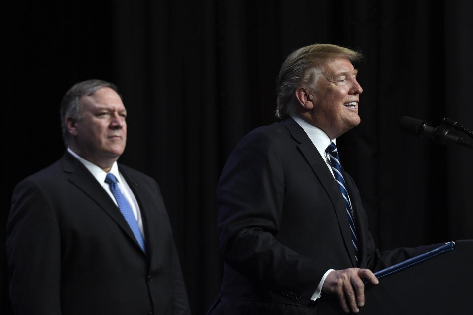 President Donald Trump, right, standing with Secretary of State Mike Pompeo, left, speaks during a news conference in Hanoi, Vietnam, Thursday, Feb. 28, 2019. (AP Photo/Susan Walsh)