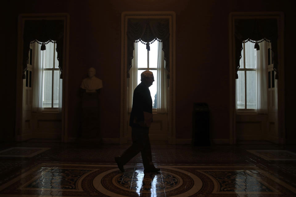 FILE - In this April 9, 2020, file photo Senate Majority Leader Mitch McConnell of Ky., walks to the Senate chamber on Capitol Hill in Washington. It's come to this for Republicans straining to defend their Senate majority in November's elections: They're air-dropping millions of dollars into races in Alabama, Kentucky and other red states where Donald Trump coasted during his 2016 presidential election triumph. (AP Photo/Patrick Semansky, File)