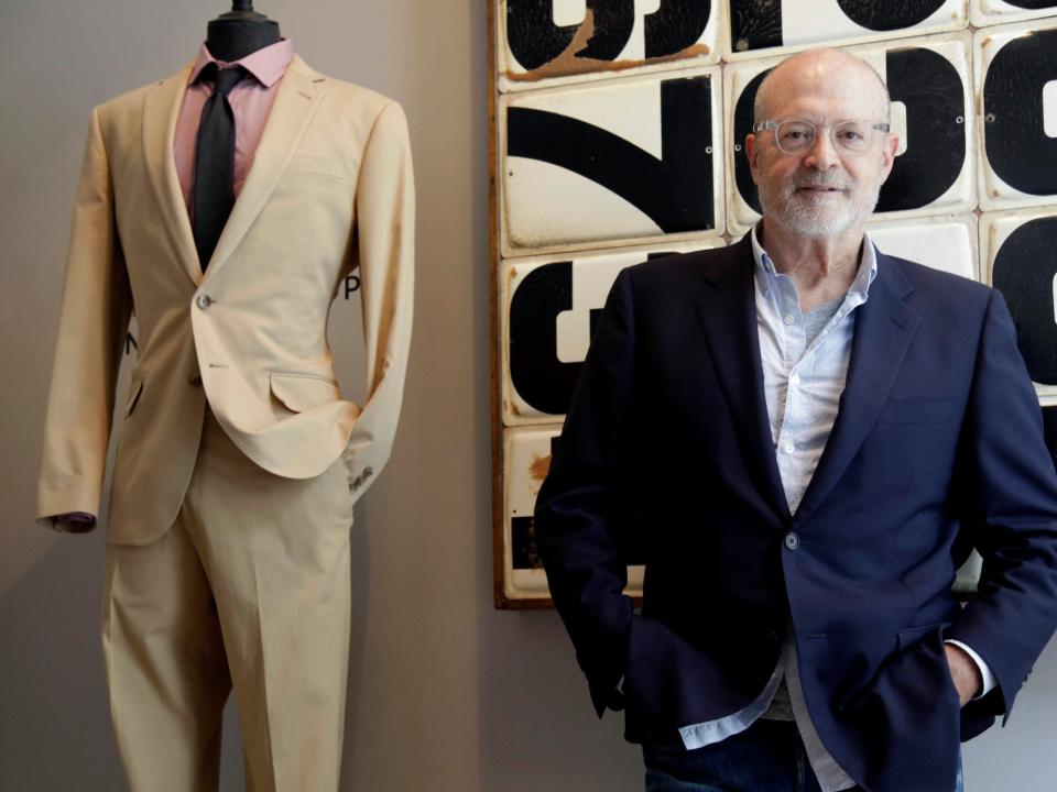 Mickey Drexler stands next to J. Crew mannequin wearing Ludlow suit