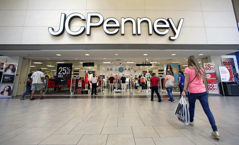 FILE - In this Wednesday, June 7, 2017, file photo, shoppers walk into a J.C. Penney department store in Hialeah, Fla. On Friday, Aug. 11, 2017,  J.C. Penney Company, Inc. Holding Company reports earnings. (AP Photo/Alan Diaz, File)