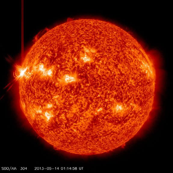 This image shows an X3.2 solar flare (far left) erupting from the sun late Monday (May 13, 2013) as seen by NASA's Solar Dynamics Observatory. It was the third major X-class solar flare in 24 hours.