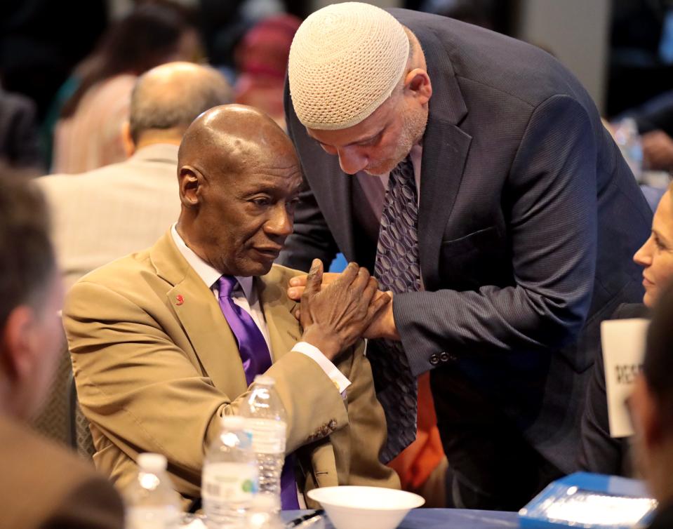 Imad Enchassi, senior imam of the Islamic Society of Greater Oklahoma City, speaks with state Sen. George Young, D-Oklahoma City, seated, as Muslims and elected leaders attend the Council on American-Islamic Relations-Oklahoma's (CAIR-OK) annual Ramadan Iftar With Elected Leaders on Friday, March 31, at the Oklahoma History Center. [Steve Sisney/For The Oklahoman]
(Photo: STEVE SISNEY, THE OKLAHOMAN)