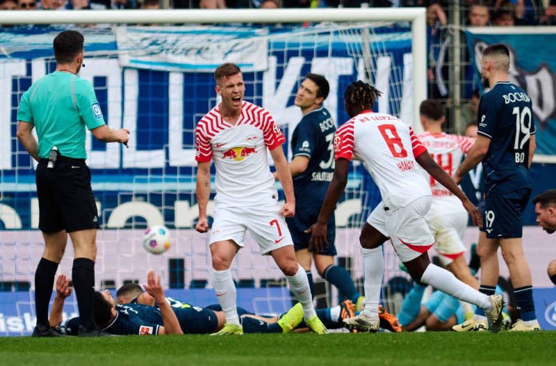 Leipzig's Dani Olmo (C) celebrates after scoring his side's first goal during the German Bundesliga soccer match between VfL Bochum and RB Leipzig at Vonovia Ruhrstadion. Bernd Thissen/dpa