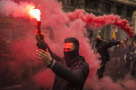 <p>Students march and light flares during the second day of a student strike in Madrid Feb. 26, 2015. Students across Spain protested changes in the system of university degrees. (AP Photo/Andres Kudacki) </p>