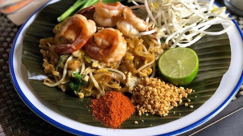 shrimp pad thai with seasoning garnish