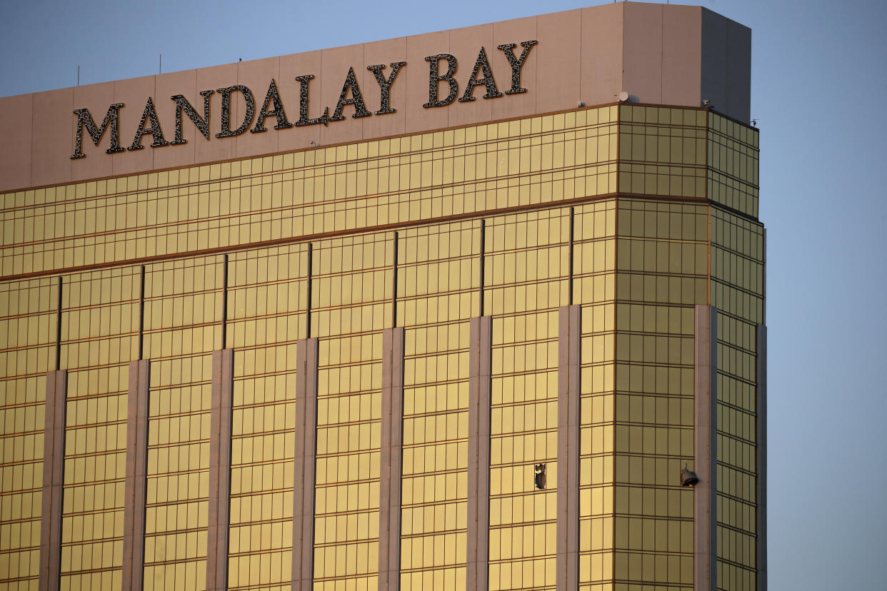 Drapes billow out of broken windows on the 32nd floor of the Mandalay Bay Resort and Casino. (Photo: John Locher/AP)