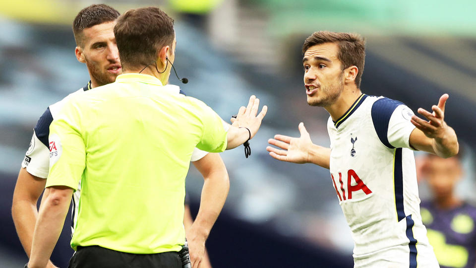 Tottenham player Harry Winks arguing with the referee.