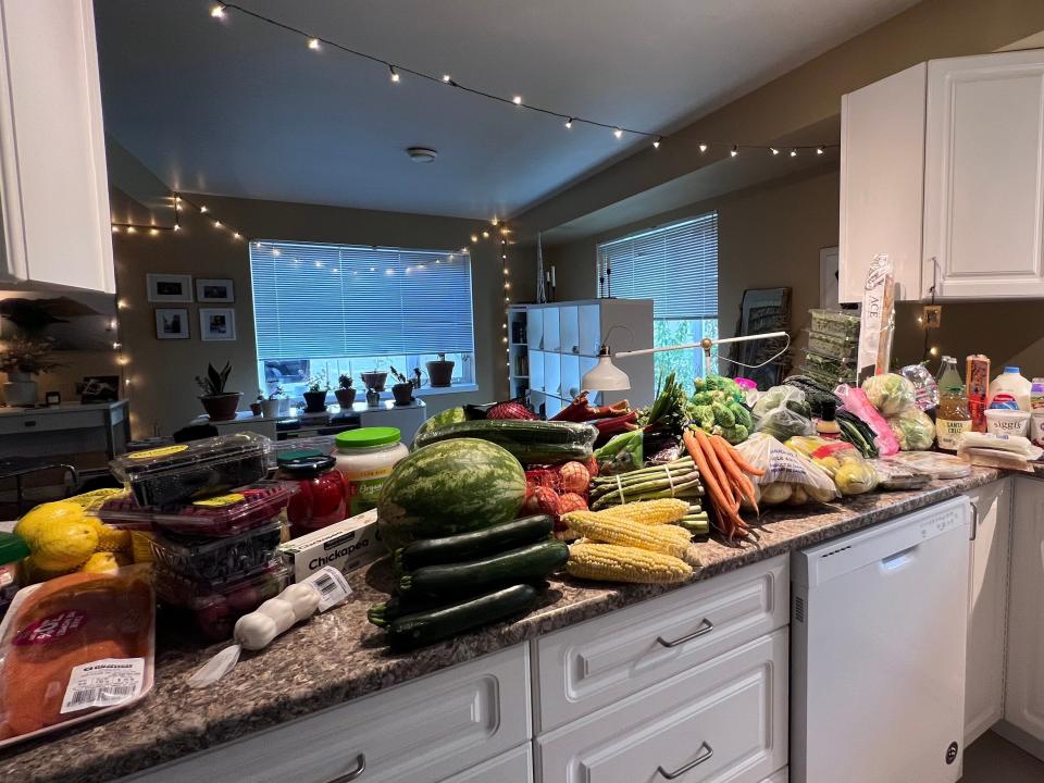 all of our groceries, like produce, spread out on our countertops in our kitchen