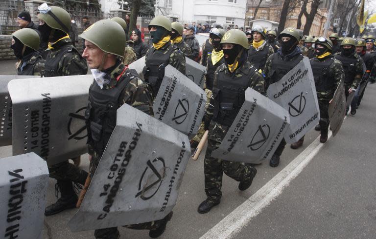 Anti-government protestors of the "14 Hundred Self-Defense" group take part in a protest rally in front of the Prosecutor General building in Kiev on February 14, 2014