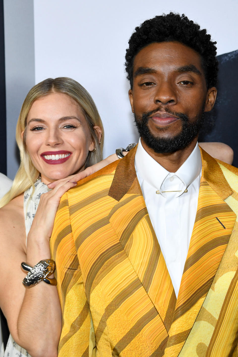 Closeup of Sienna Miller and Chadwick Boseman