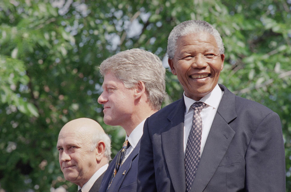 FILE - From left, F.W. de Klerk, President Bill Clinton, and Nelson Mandela appear at ceremonies honoring the two South African leaders with the Philadelphia Liberty Medal at Independence Hall in Philadelphia, July 4, 1993. (AP Photo/Greg Gibson, File)