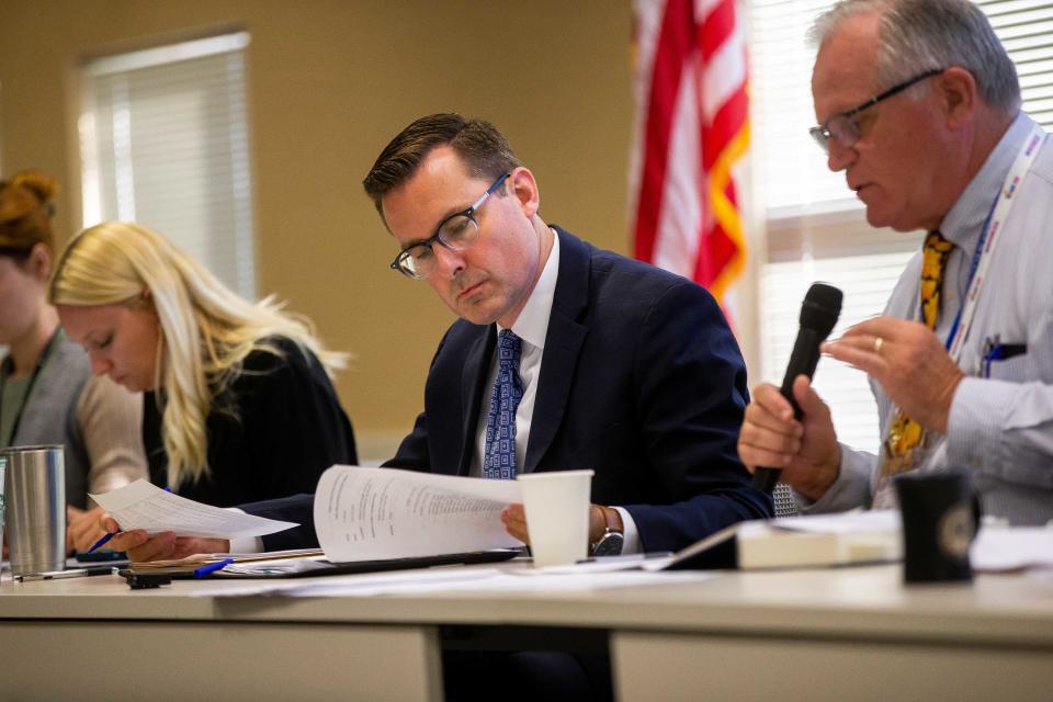 County Clerk Justin Roebuck reads the agenda for a petition language hearing Monday, July 17, 2023.