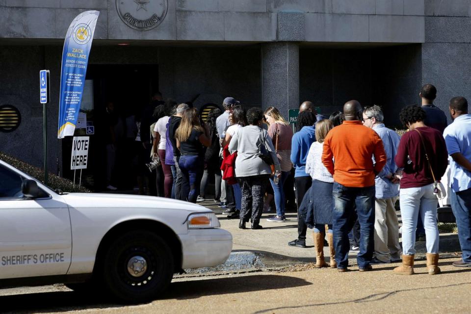 PHOTO: In this Nov. 24, 2018, file photo, voters wait in line to cast their absentee ballots in Jackson, Miss. (Jonathan Bachman/Reuters, FILE)