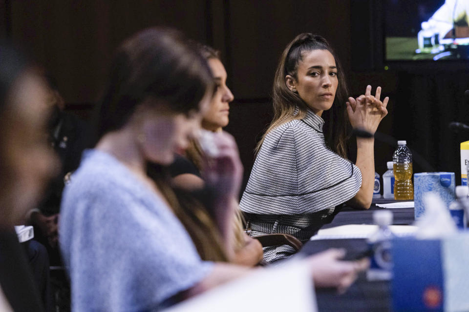 United States gymnasts from left, Simone Biles, McKayla Maroney, Maggie Nichols, and Aly Raisman testify during a Senate Judiciary hearing about the Inspector General's report on the FBI's handling of the Larry Nassar investigation on Capitol Hill, Wednesday, Sept. 15, 2021, in Washington. Nassar was charged in 2016 with federal child pornography offenses and sexual abuse charges in Michigan. He is now serving decades in prison after hundreds of girls and women said he sexually abused them under the guise of medical treatment when he worked for Michigan State and Indiana-based USA Gymnastics, which trains Olympians. (Graeme Jennings/Pool via AP)