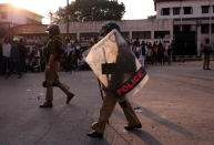 Policemen patrol in a riot affected area after clashes erupted between people demonstrating for and against a new citizenship law in New Delhi, India, February 25, 2020. REUTERS/Danish Siddiqui