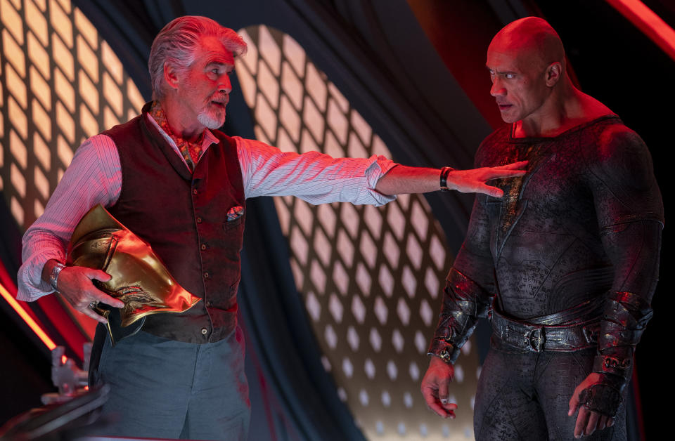 (L-r) PIERCE BROSNAN as Dr. Fate and DWAYNE JOHNSON as Black Adam in New Line Cinema’s action adventure “BLACK ADAM,” a Warner Bros. Pictures release.
