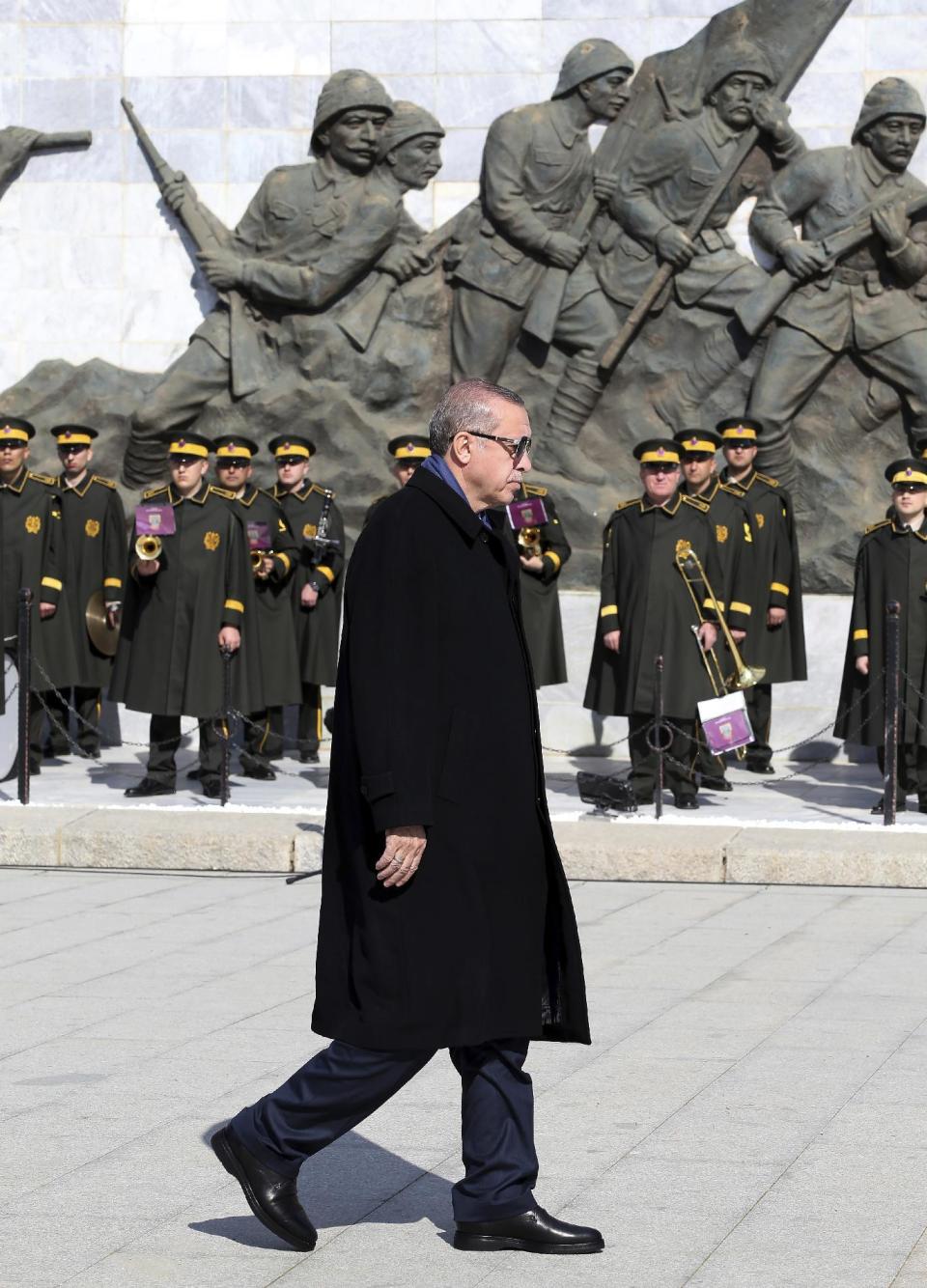 Turkey's President Recep Tayyip Erdogan walks during a ceremony marking the 102nd anniversary of Gallipoli campaign, in Gallipoli peninsula where troops under British command landed in 1915, Saturday, March 18, 2017. Cheered by flag-waving supporters, the Turkish president turned a commemoration of a World War I campaign into a political rally on Saturday, slamming Europe and declaring that a constitutional referendum next month on whether to expand his powers will enhance Turkey's place in the world.(Kayhan Ozer/Presidential Press Service, Pool Photo via AP)