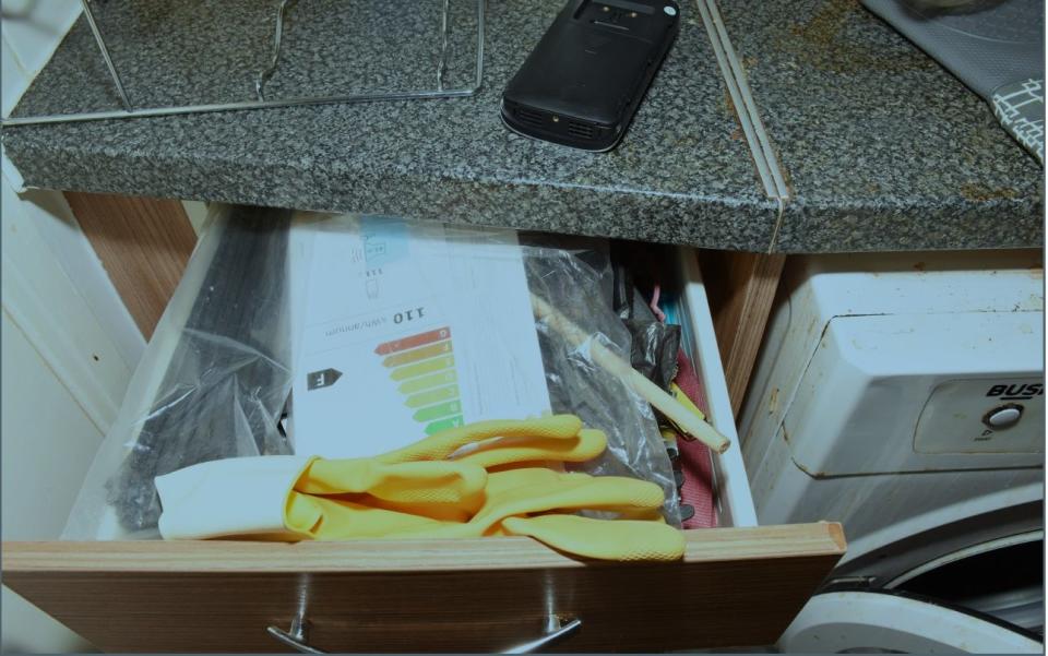 A photograph of an open drawer including cable ties