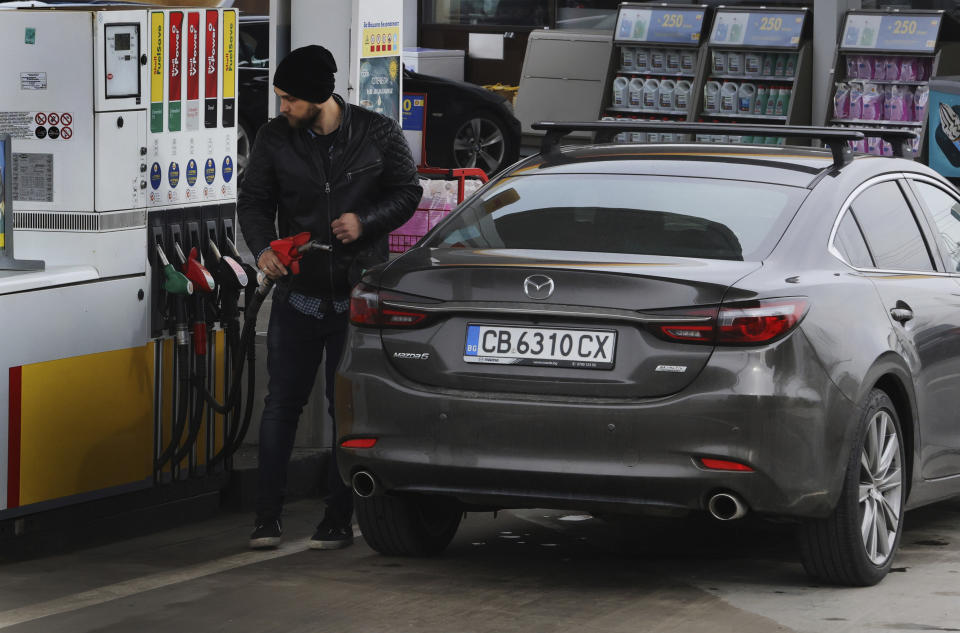 A man refuels his car at a service station in Sofia, Bulgaria, on Thursday, April 21, 2022. Rising energy prices in Europe are testing the resolve of those caught between a dependence on cheap Russian energy and their revulsion at Moscow’s war in Ukraine. Governments are trying to replace Russian energy, mindful their regular payments are funding the invasion. (AP Photo/Valentina Petrova)
