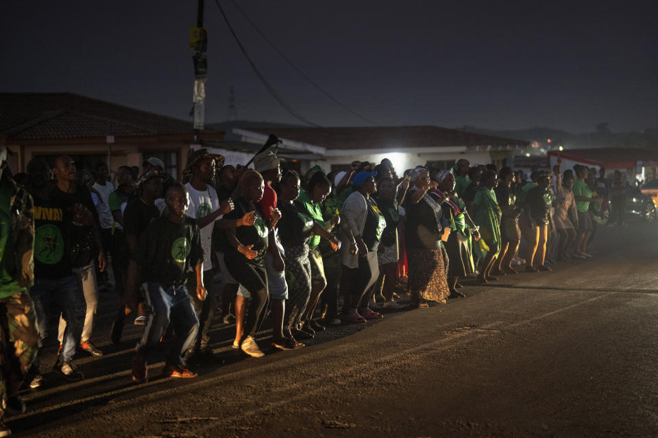 MK Party supporters dance in the middle of the street in Mahlbnathini village in rural KwaZulu-Natal, South Africa, on Thursday May 30, 2024. MK Party is currently leading in the provincial poll against the ANC, who've held the stronghold in the province for the last 20 years. (AP Photo/Emilio Morenatti)