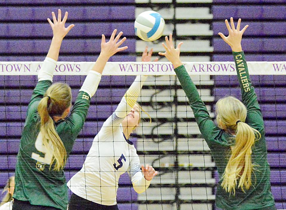 Watertown's Emery Thury hits the ball against Sioux Falls Jefferson's Emory Brosnahan and Brooke Thorstenson during their high school volleyball match on Tuesday, Oct. 18, 2022 in the Civic Arena. Jefferson won 3-1.