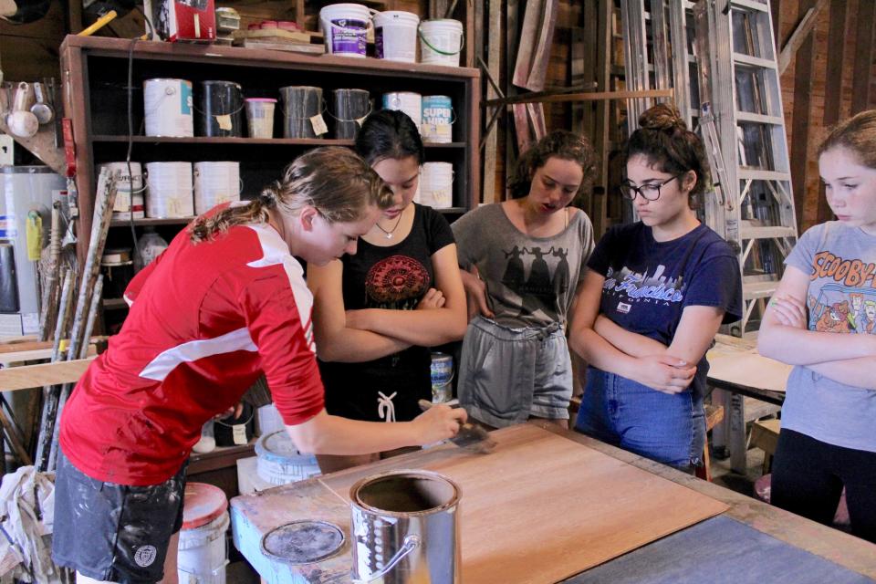 Students get some hands-on experience in set-building and decorating at one of the Cape Playhouse's summer workshops, which enroll each winter.