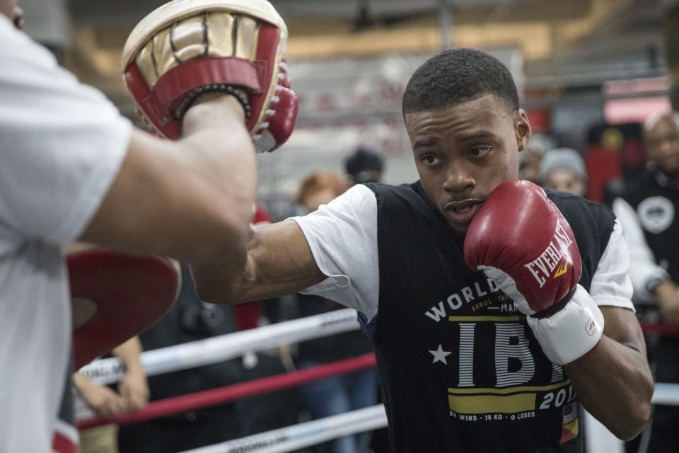 Errol Spence Jr. throws a punch while sparring with a trainer during a workout at Gleason's Gym, Wednesday, Jan. 17, 2018, in the Brooklyn borough of New York. Spence is slated to defend his IBF welterweight title against Lamont Peterson on Saturday in Brooklyn.(AP Photo/Mary Altaffer)