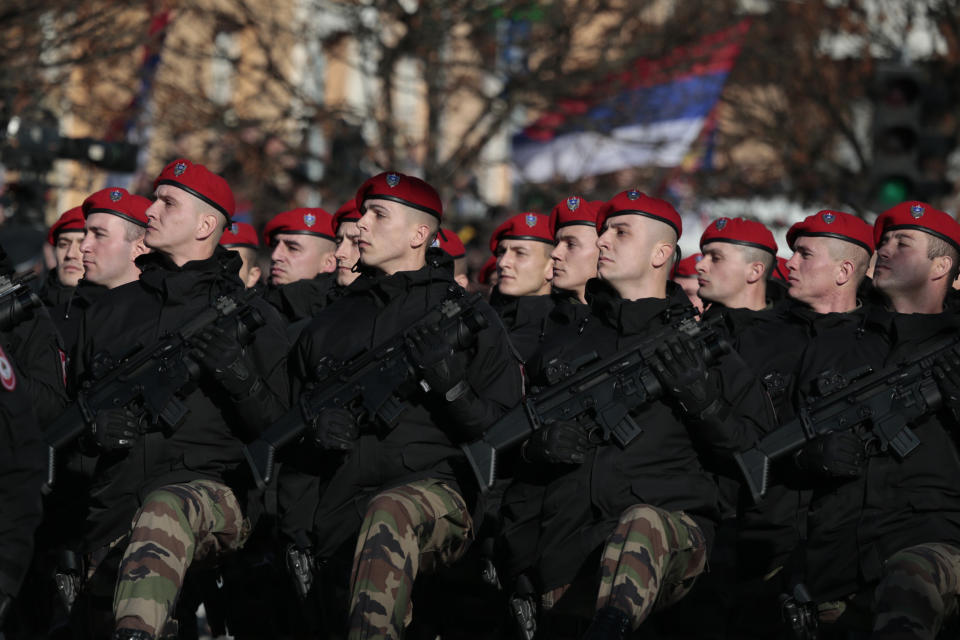 Members of the police forces of the Republic of Srpska march during a parade marking the 27th anniversary of the Republic of Srpska in the Bosnian town of Banja Luka, Wednesday, Jan. 9, 2019. In a show of nationalist defiance, Bosnian Serbs are celebrating a controversial holiday despite strong opposition from other ethnic groups in Bosnia who view it as discriminatory. Waving Serb flags, several thousand people on Wednesday lined up in the main Serb city of Banja Luka to watch a celebratory parade of security troops, firefighters, cultural and sport groups. (AP Photo/Amel Emric)