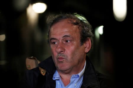 Former head of European football association UEFA Michel Platini leaves a judicial police station where he was detained for questioning over the awarding of the 2022 World Cup soccer tournament, in Nanterre