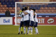 Vancouver Whitecaps players celebrate their victory over the Portland Timbers following their MLS soccer game, Sunday, April 18, 2021, in Sandy, Utah. (AP Photo/Rick Bowmer)