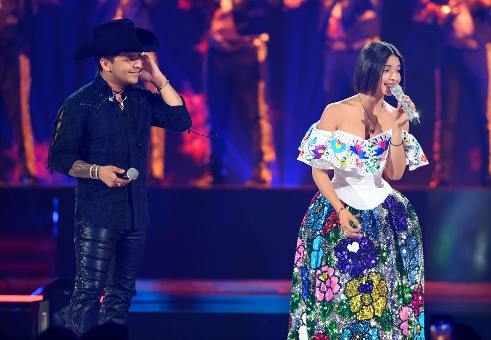 Christian Nodal, left, and Ángela Aguilar perform onstage during Premios Juventud 2019 at Watsco Center in Coral Gables, Florida, on July 18, 2019.