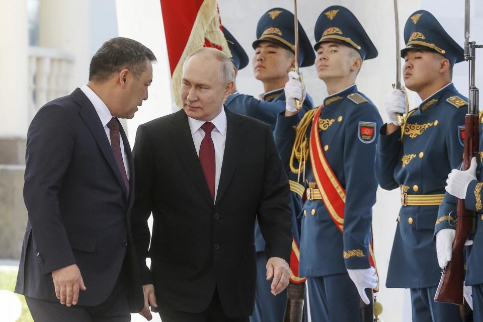 Russian President Vladimir Putin, front right, and Kyrgyzstan's President Sadyr Japarov, front left, attend a military welcome ceremony prior to their talks in Bishkek, Kyrgyzstan, Thursday, Oct. 12, 2023. (Sergei Karpukhin, Sputnik, Kremlin Pool Photo via AP)