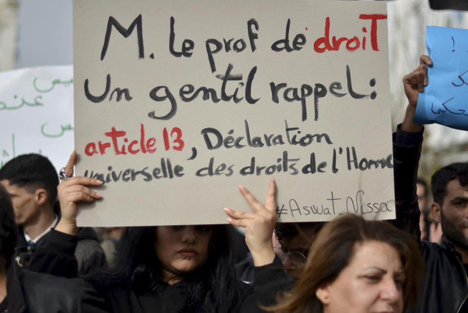 People demonstrate against Tunisian President Kais Saied's comment on migration, Saturday, Feb. 25, 2023 in Tunis. President Kais Saied said Tuesday that "urgent measures" were needed to address the entry of irregular immigrants from sub-Saharan countries, "with their lot of violence, crimes and unacceptable practices." Saied's comments at a National Security Council meeting raised a storm on social media and condemnations from nongovernmental organizations. (AP Photo/ Hassene Dridi)