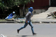 A demonstrator runs during a clash with supporters of Nicaraguan president Daniel Ortega's government in Managua, Nicaragua September 23, 2018. REUTERS/Oswaldo Rivas