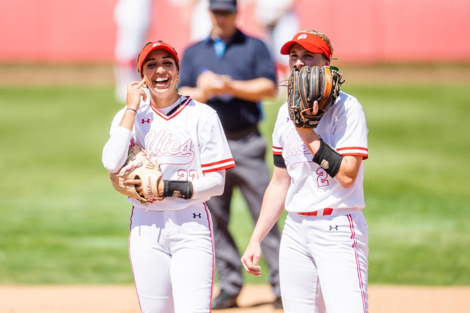 Utah infielder Aliya Belarde (23) and Utah infielder Ellessa Bonstrom (2), left to right, laugh during an NCAA softball game between Utah and UCLA at Dumke Family Softball Stadium in Salt Lake City on April 29, 2023. | Ryan Sun, Deseret News