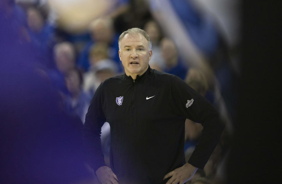 St. Thomas head coach Johnny Tauer watches as his team plays against Creighton during the first half of an NCAA college basketball game on Monday, Nov. 7, 2022, in Omaha, Neb. (AP Photo/Rebecca S. Gratz)