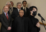 Pianist Bruce (Xiaoyu) Liu, right of Canada speaks after being named as the winner of the 40,000-euro ($45,000) first prize in the 18th Frederic Chopin international piano competition, a prestigious event that launches pianists’ world careers. Almost 90 pianists from around the globe took part in the 18th edition of the competition that was postponed from 2020 due to the pandemic. (AP Photo/Czarek Sokolowski)