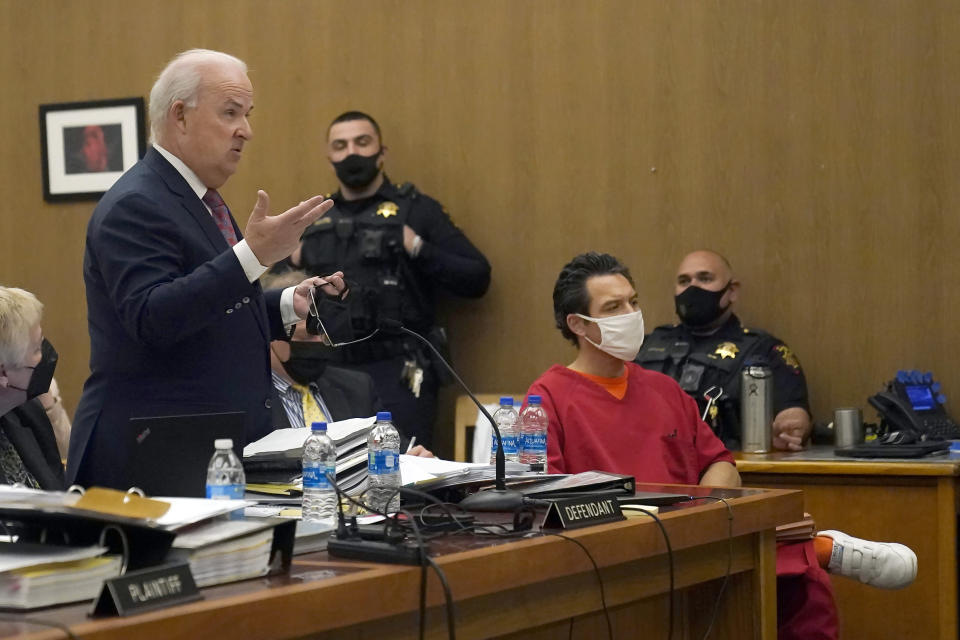 Scott Peterson, seated at right, listens as attorney Pat Harris, standing, speaks during a hearing at the San Mateo County Superior Court in Redwood City, Calif., Monday, Feb. 28, 2022. (AP Photo/Jeff Chiu, Pool)