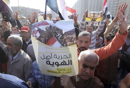 People shout slogans against the military and interior ministry during an Islamist protest in the Cairo suburb of Matariya November 28, 2014. REUTERS/Mohamed Abd El Ghany