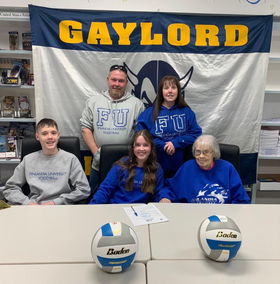 Gaylord's Hannah Fisher poses with her family after signing her LOI to play volleyball at Finlandia University in college.