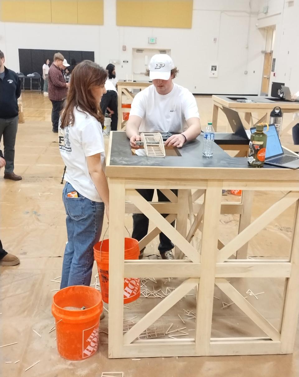 Clinton High School students recently competed in the 45th Annual Purdue Bridge Bust competition hosted by the student chapter of Purdue University American Society of Civil Engineers. The competition tested the students on three key elements of bridge construction including load bearing efficiency, aesthetics of design and construction, and a presentation of research and structural design components.