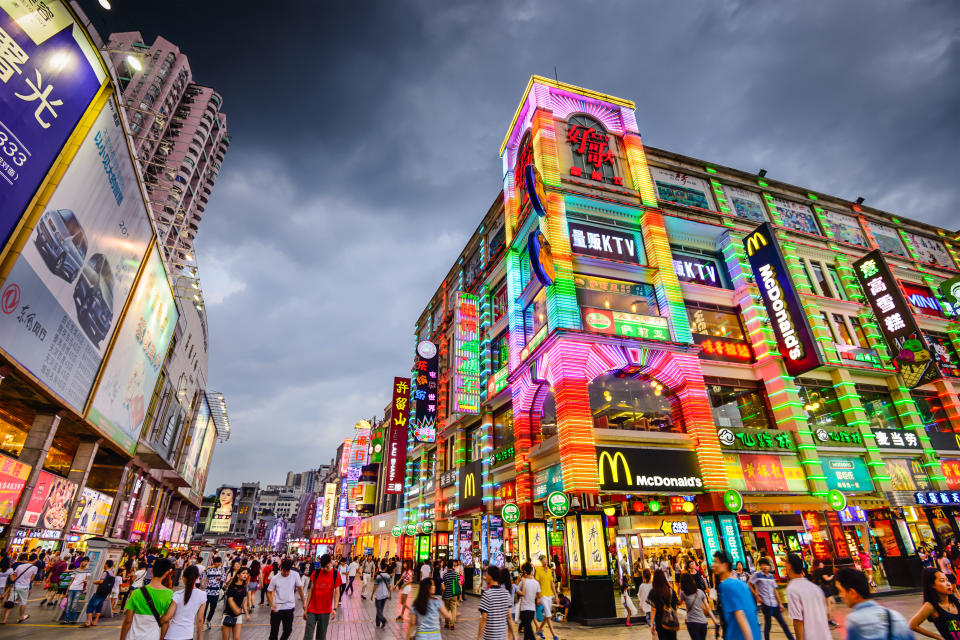 Pedestrians pass through Shangxiajiu Pedestrian Street. The street is the main shopping district of the city and a major tourist attraction. (Photo: Gettyimages)