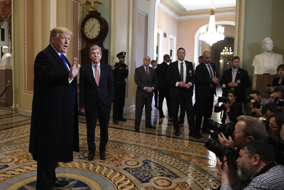 President Donald Trump speaks to members of the media as he arrives for a Senate Republican policy lunch on Capitol Hill in Washington, Tuesday, March 26, 2019. (AP Photo/Susan Walsh)