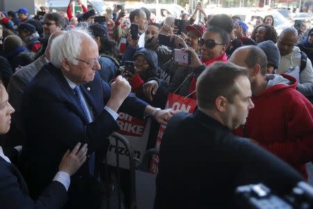 U.S. Democratic presidential candidate and U.S. Senator Bernie Sanders greets Communications Workers of America (CWA) workers striking against Verizon in Brooklyn, New York April 13, 2016. REUTERS/Brian Snyder