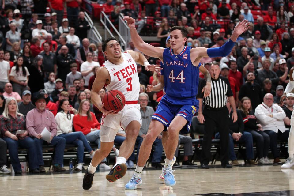 Texas Tech's Clarence Nadolny (3) dribbles the ball against Kansas' Mitch Lightfoot (44) during the first half of a Big 12 Conference game Jan. 8 at United Supermarkets Arena. Nadolny finished with a career-best 17 points in a 75-67 win over the Jayhawks.