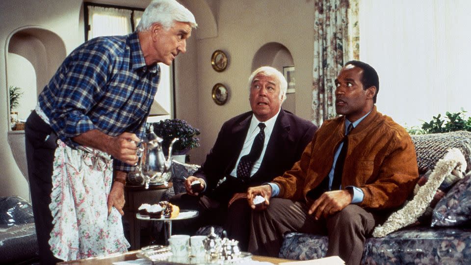 Actors Leslie Nielsen, George Kennedy and O.J. Simpson in the 1994 film "Naked Gun." - Paramount/Courtesy Everett Collection