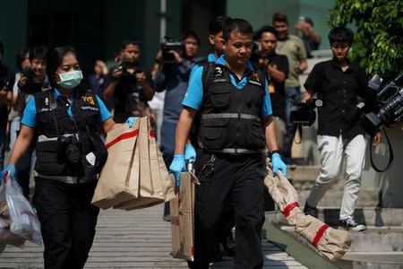 Thai forensic police carry evidence as they leave from a site of bomb blast at the Phramongkutklao Hospital in Bangkok, Thailand, May 22, 2017. REUTERS/Athit Perawongmetha