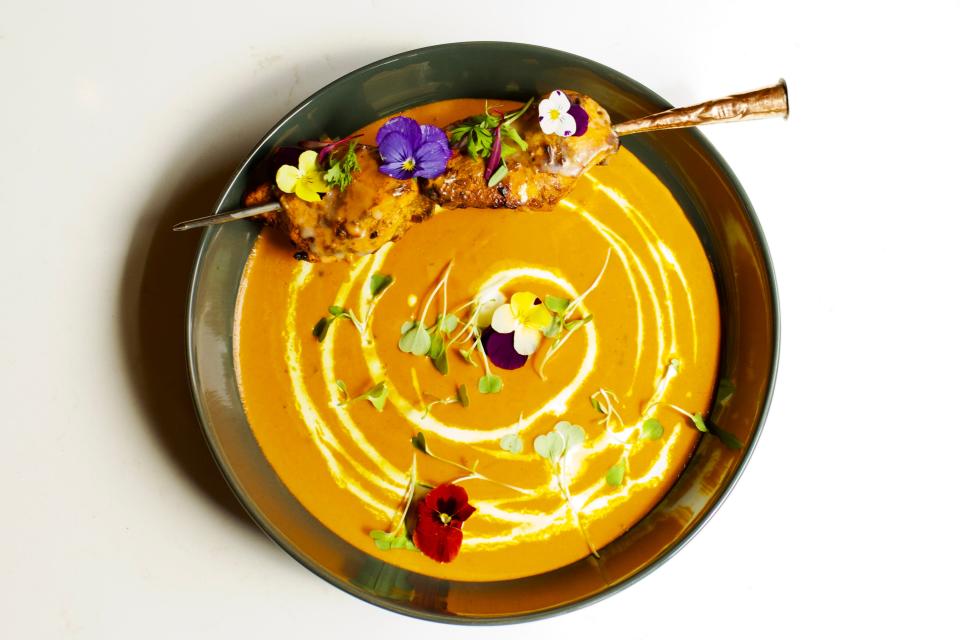 Plating is modern at Saffron, as in this menu item, Saffron butter chicken. Saffron opens to the public June 4 at 223 N. Water St.